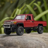 MN82 Toyota Land Cruiser 4WD RTR 1/12 Truck Crawler Left view sitting on a rock with folage in the back drop